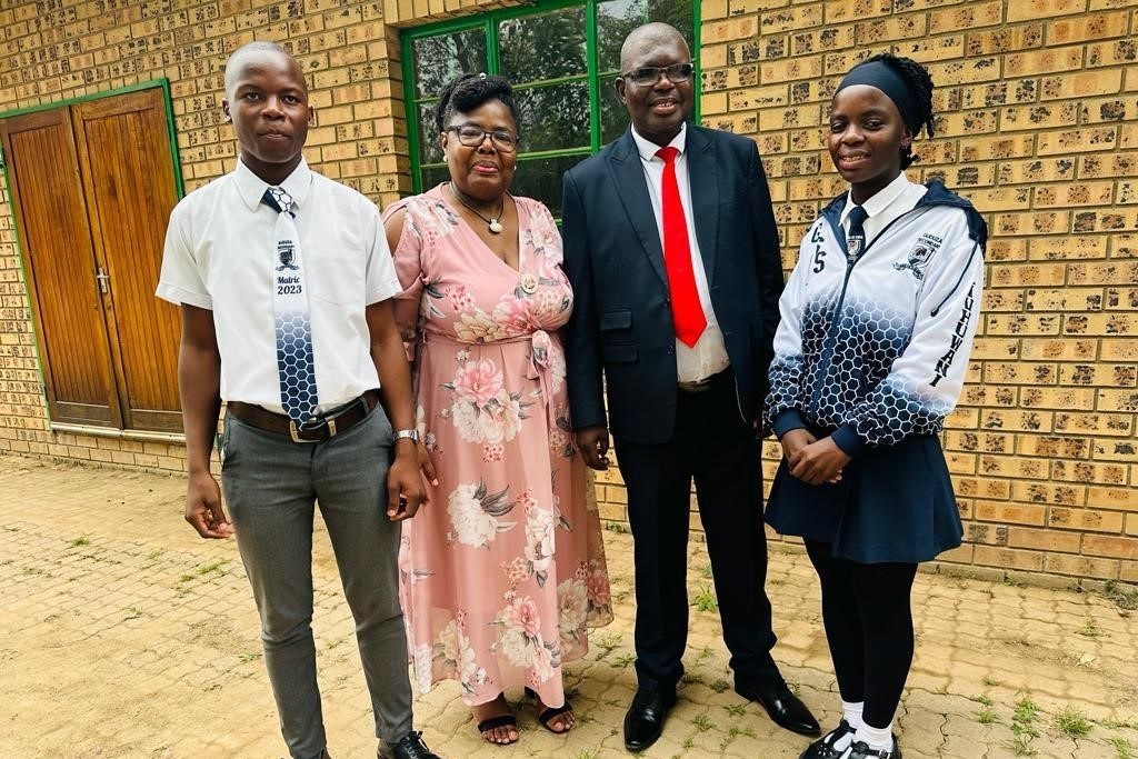 Nhlakanipho Maseko with education department HOD, Busi Moyane, MEC Bonakele Majuba and pupil Cebile Matukane. 