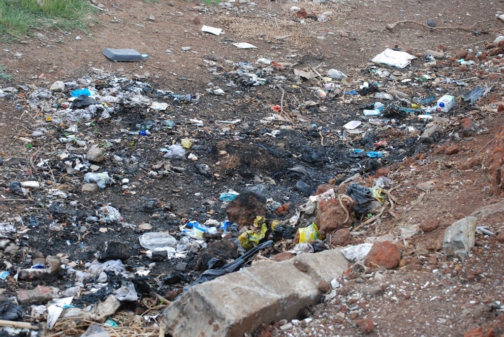 This is the spot at a dumping site where police found some of the burned body parts. Photo by Khaya Masipa