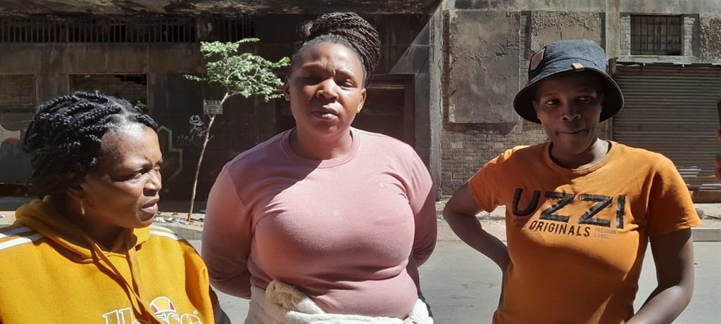 From the left: Mopeli Kwenene, Boitumelo Maribe and Serialong Ralonya are among those who lost their passports and clothes in the fire. Photo by Zandile Khumalo