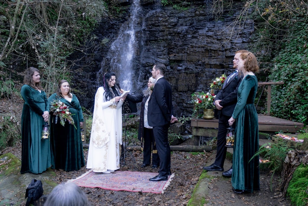 Ines and Arthur Knox tie the knot under a waterfall.