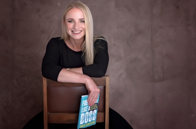 Author Shea Karssing with her book, Freelance Like a Boss: How To Escape The 9–5 And Take Control of Your Life (published by Penguin Random House).