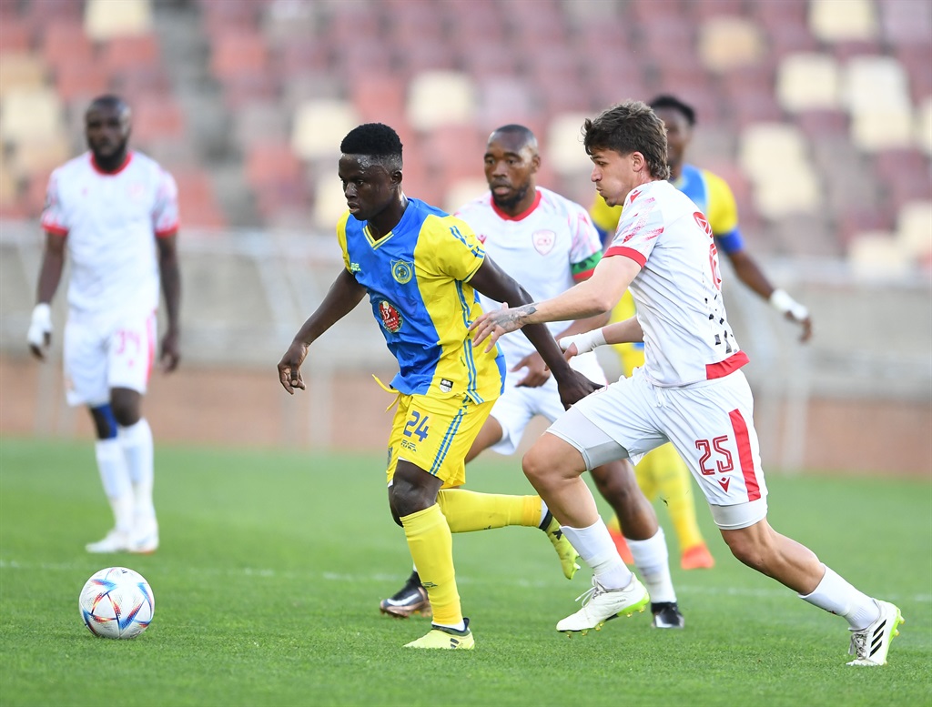 POLOKWANE, SOUTH AFRICA - SEPTEMBER 16: Dramane Kambou of Saint Eloi Lupopo and Meguel Dias of Sekhukhune United during the CAF Confederation Cup, 2nd preliminary round - leg 1 match between Sekhukhune United and Saint Eloi Lupopo at Peter Mokaba Stadium on September 16, 2023 in Polokwane, South Africa. (Photo by Philip Maeta/Gallo Images)