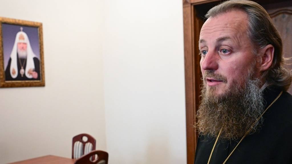 Bishop Ioan of Soroca, Vicar of the Metropolitanate of Moldova belonging to the Russian patriarchate, looks on inside his office as a photograph on a wall depicts the Russia's Patriarch Kirill, in Chisinau.