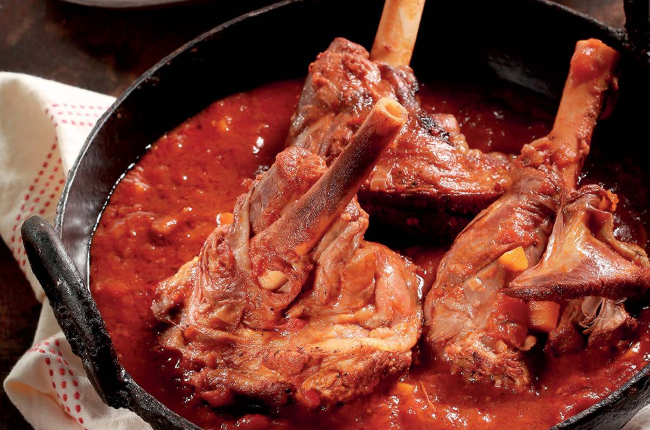 Lamb shanks paired with a glass of Cabernet Sauvignon