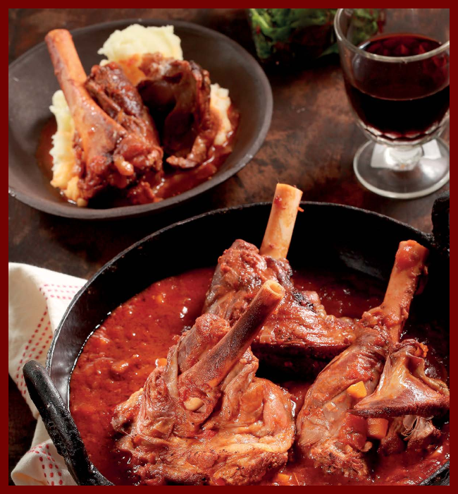 Lamb shanks paired with a glass of Cabernet Sauvig