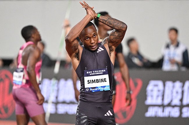 South Africa's Akani Simbine celebrates after winning the men's 100m during the IAAF Diamond League athletics meeting in Suzhou. (HECTOR RETAMAL / AFP)
