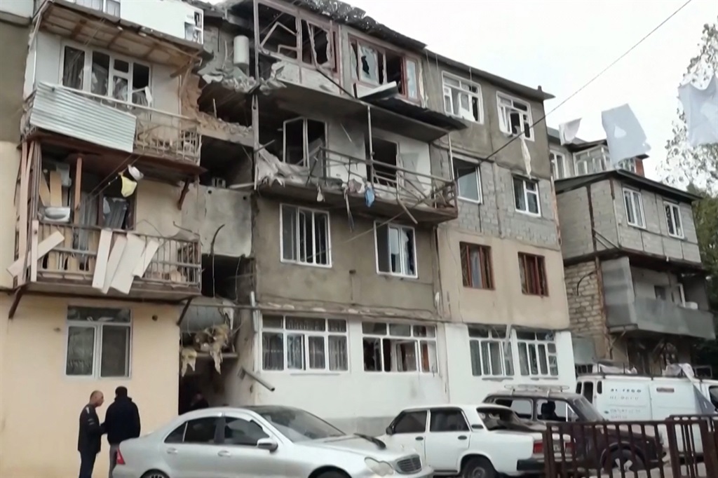 A video grab made from footage released by the Nagorno-Karabakh Foreign Ministry shows damaged apartment buildings in Stepanakert, on the first day of Azerbaijan's offensive on the region.  (Photo by Nagorno-Karabakh Foreign Ministry / AFP)