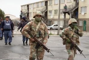 SANDF members in Manenberg. Their presence has raised questions in some quarters about their effectiveness as a crime deterrent. (Rodger Bosch, AFP)
