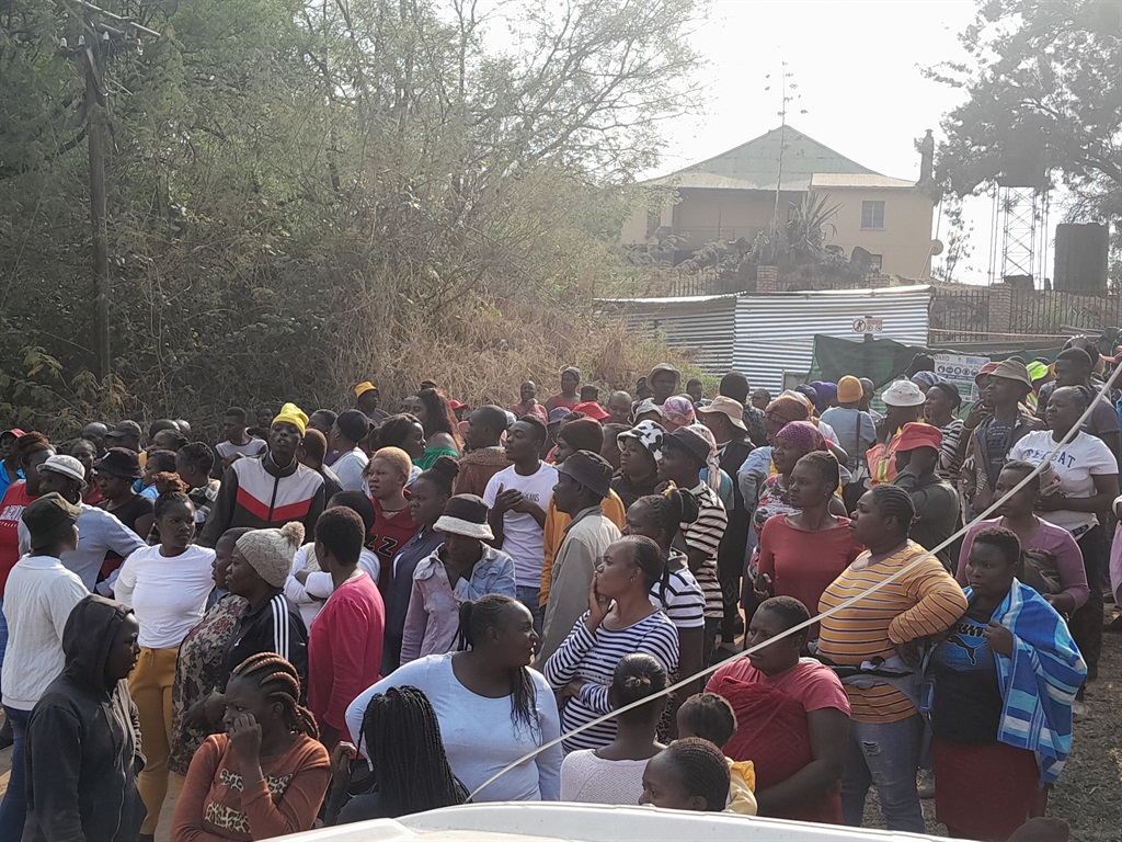 Residents gathered at the construction site after they were allegedly promised jobs. Photo by Thembi Siaga