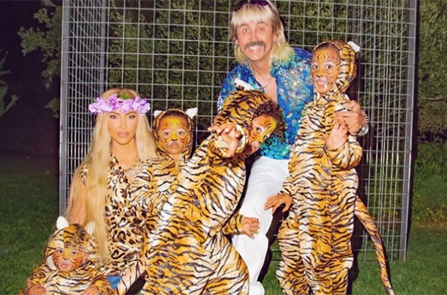 Kim Kardashian and Jonathan Cheban dress up as Carole Baskin and Joe Exotic, accompanied by their tigers.