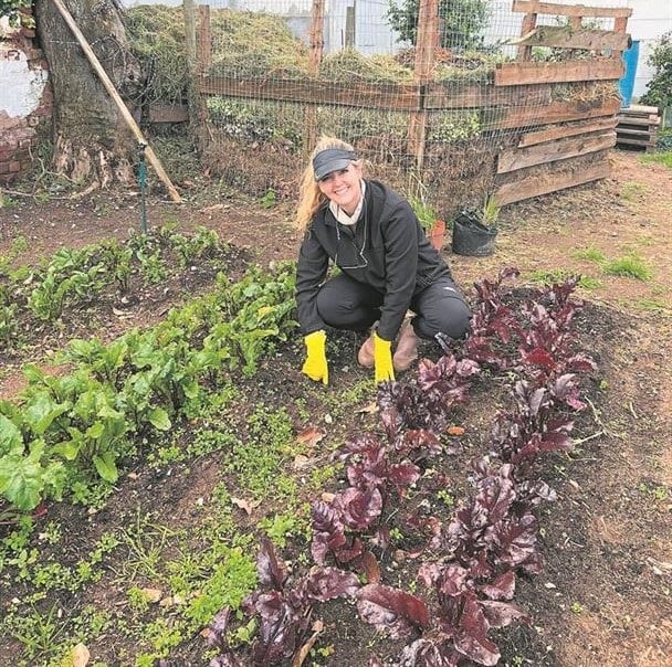 The Community Garden’s first customer who had been living in Plumstead for 60 years is Cynthia Hepne posing alongside green-thumb-gardener, Kenny Chibhamy.