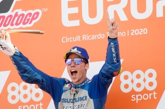 Joan Mir celebrates his first victory in MotoGP class on the podium at the end of the MotoGP race at Comunitat Valenciana Ricardo Tormo Circuit. image: Mirco Lazzari / Getty Images. 
