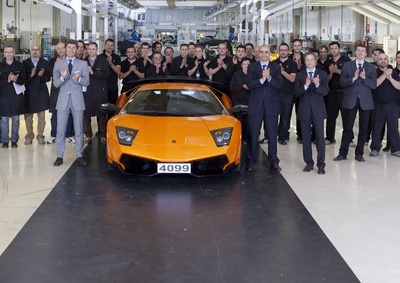 STANDING OVATION: Lamborghini boss Stephan Winkelmann (in the grey suit) joins his assembly team in bidding the last Murcielago a fond farewell.