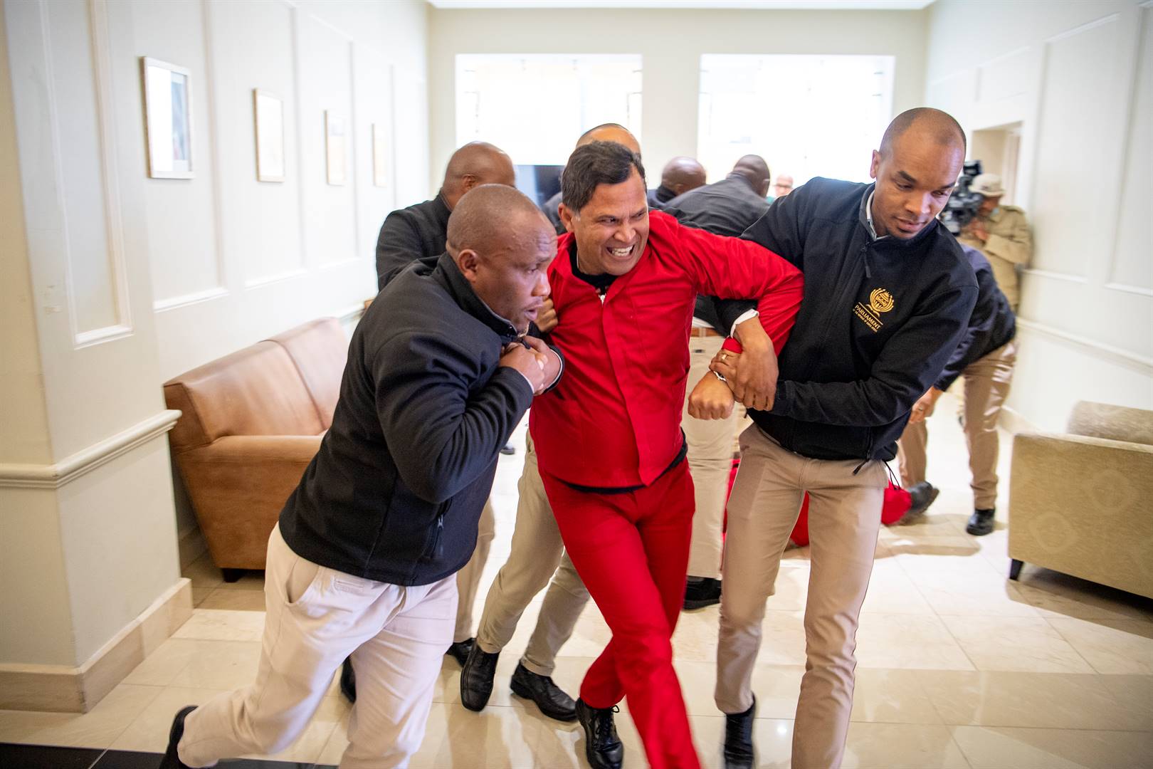 EFF MP, Nazier Paulsen, being removed from Parliament.