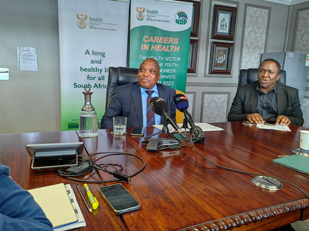 Health Minister Joe Phaahla, left, together with his spokesperson, Doctor Tshwale, briefed the media on the contentious R1.2 billion security contract before the courts.