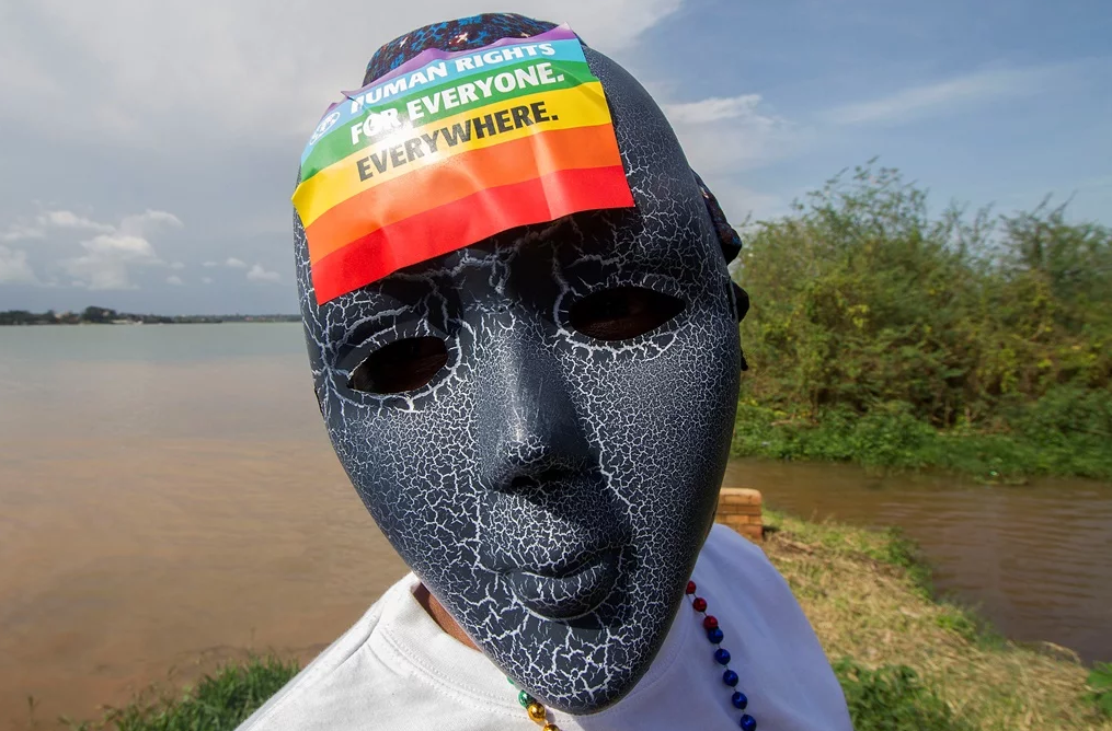 A Ugandan wearing a mask with a rainbow sticker takes part in the Gay Pride parade in Entebbe. (Isaac Kasamani, AFP)