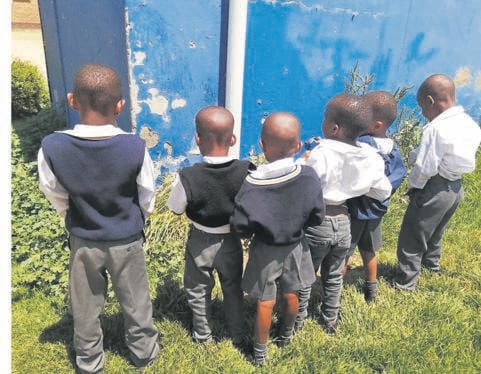 Boys from Mtjoli Primary School peeing on the grass because their school toilets are too filthy      Photo by         Sibonelo Zwane