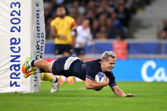 Darcy Graham of Scotland scores the team's twelfth try against Romania at Stade Pierre Mauroy in Lille. (Photo by Stu Forster/Getty Images)