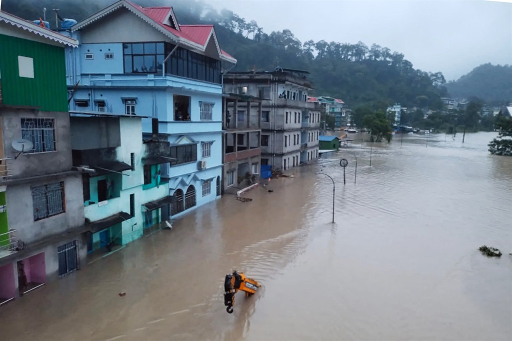 This handout photograph released by the Indian Army and taken on 4 October 2023 shows a flooded street in Lachen Valley, in India's Sikkim state following a flash flood. (Photo by INDIAN ARMY / AFP)