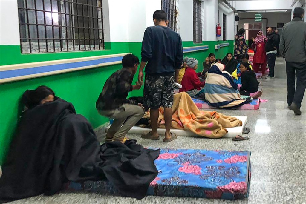 Survivors are seen at a corridor of the Jajarkot district hospital in the aftermath of an earthquake in Jajarkot on 4 November 2023. 
