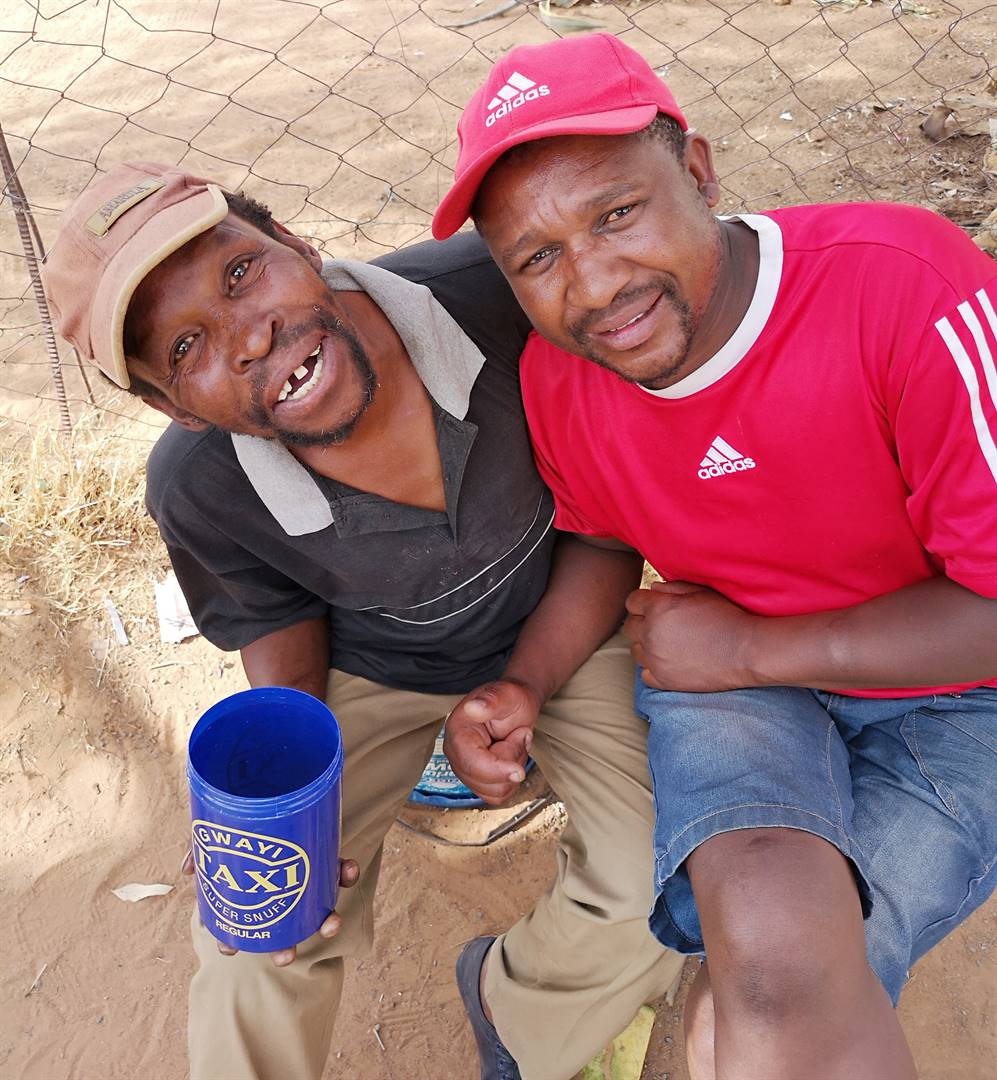 Best friends Doctor Tangala (54) and Ncedani Mqhakayi (46) said drinking traditional beer, pine, made them calmer and reduced their high anger levels.  Photo by Kabelo Tlhabanelo.
