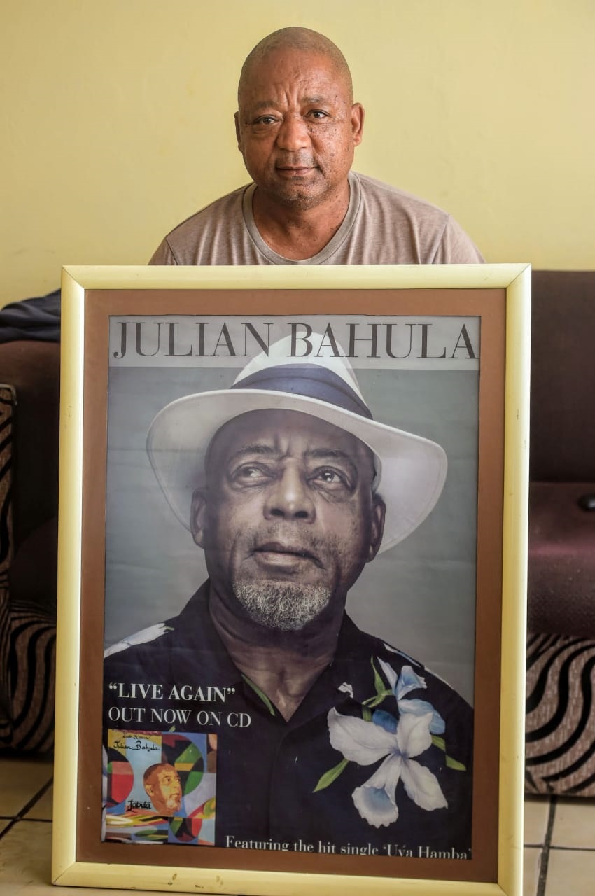 Kenneth Bahula (54) with the potrain of his late u