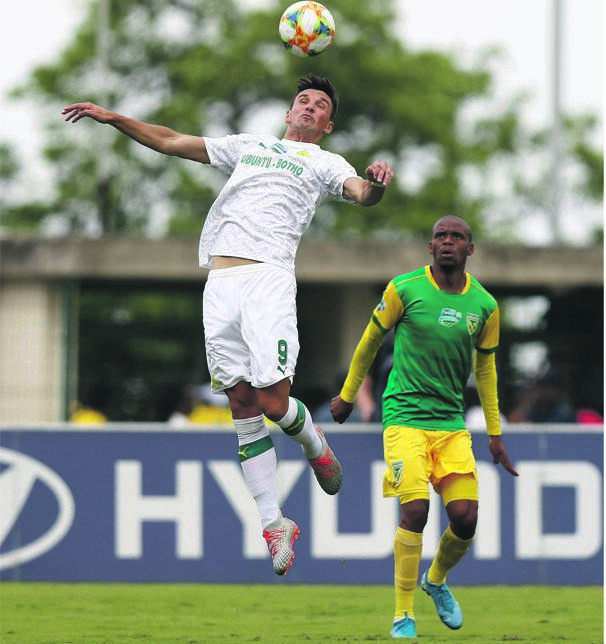 Gladwin Shitolo of Golden Arrows watches as Mamelodi Sundowns’ Mauricio Affonso clears the ball during their Telkom Knockout semifinal at Sugar Ray Xulu Stadium yesterday. Picture: Anesh Debiky / Gallo Images