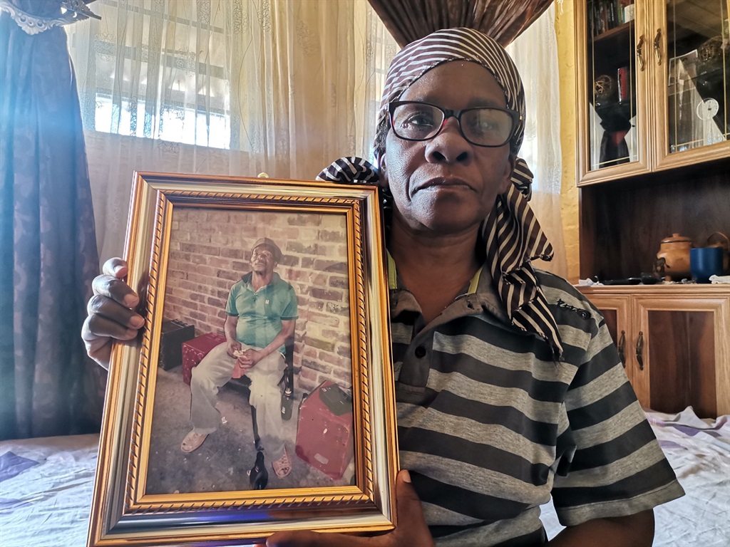 Lillian Mazibuko with a picture of her late husband, Robert Mazibuko. Photo by Bulelwa Ginindza