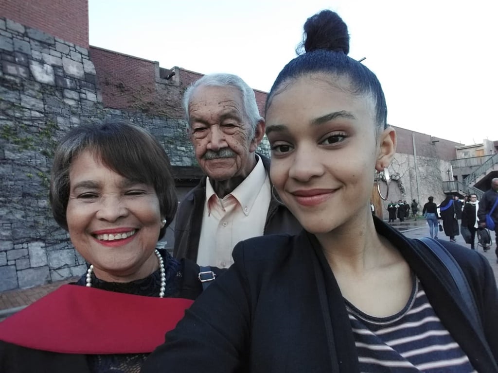 Jesse Hess with her grandparents Chris and Cathy after her grandmother completed her Level 5 Higher Certificate in Early Childhood Development. (Supplied, Sandy Hess)