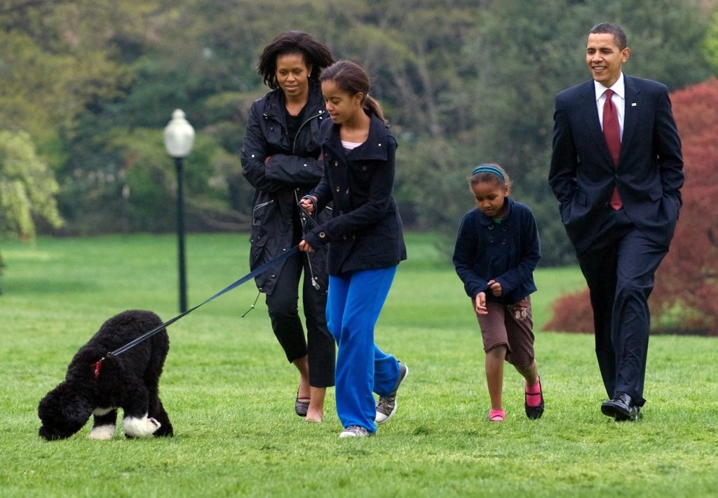Malia Obama walks her Portuguese water dog, Bo
