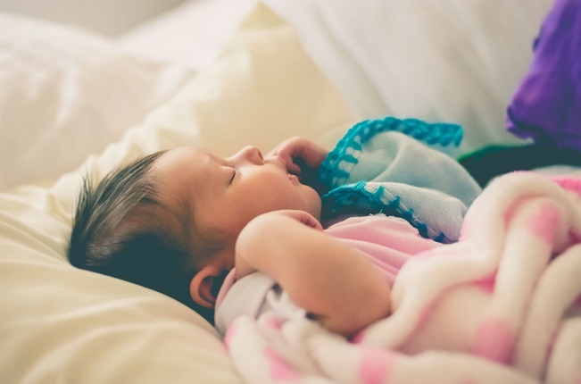 Even if you have visitors over make sure your baby remains in a good sleep routine. Photo: Unsplash/ Felipe Salgado.
