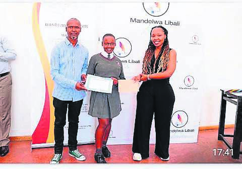 Playwright and author, Sonwabo Yawa, and founder for Mandelwa Creative PTY Ltd, Pumeza Macingwane, with Zenande James from St George’s Senior Secondary School in Mount Frere who also went home with a prize from this festival.                      