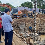 Vietnam rescuers battle to save boy from 35-metre hole