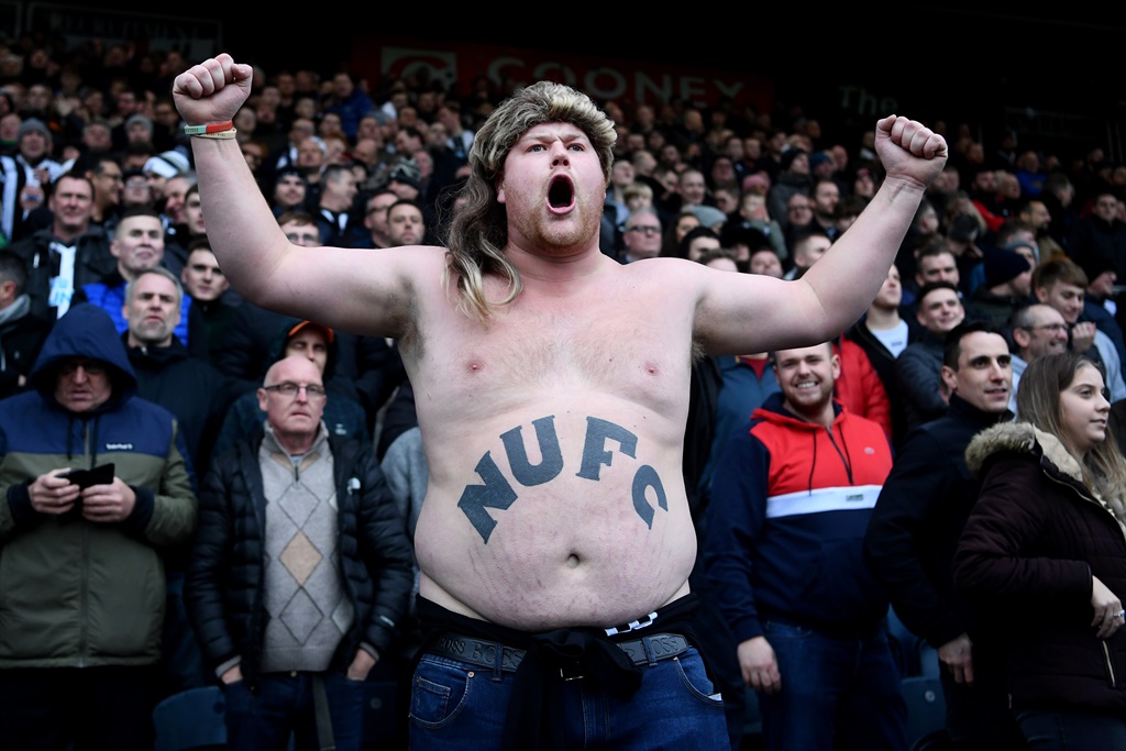 A Newcastle United fan cheers on his team during the FA Cup Third Round match between Rochdale AFC and Newcastle United at Spotland Stadium  in Rochdale, England, on January 4. Picture: Laurence Griffiths/Getty Images