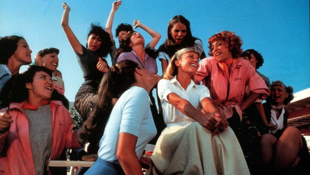 Olivia Newton-John, Didi Conn and the rest of the girls sing in a scene from the film 'Grease', 1978