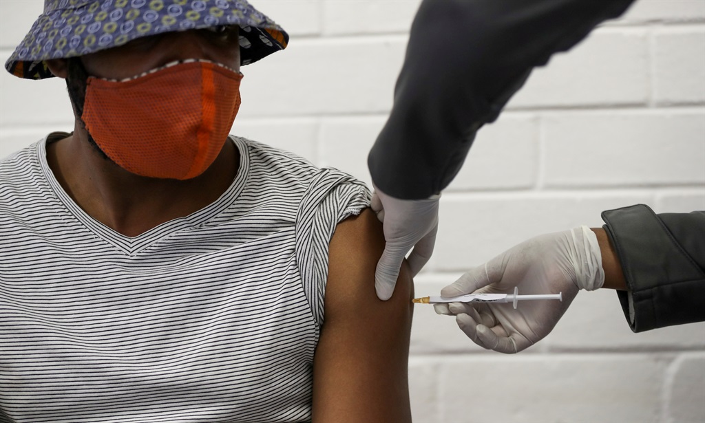 A volunteer receives an injection from a medical worker during the country's first human clinical trial for a potential vaccine against the Covid-19 coronavirus, at Baragwanath Hospital in Soweto. Picture: Siphiwe Sibeko/File Photo