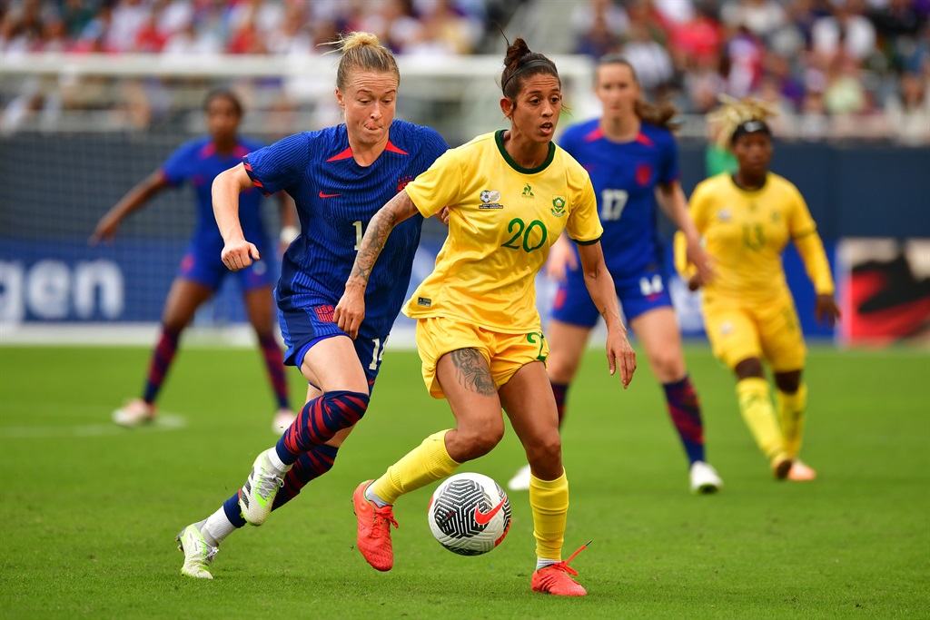 Robyn Moodaly #20 of South Africa battles for the ball with  Emily Sonnett #14 of the United States.