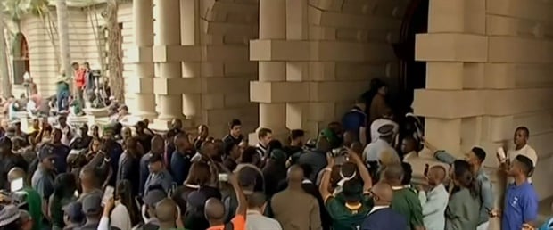 Fans mob the Boks as they make their way into Durban City
Hall


