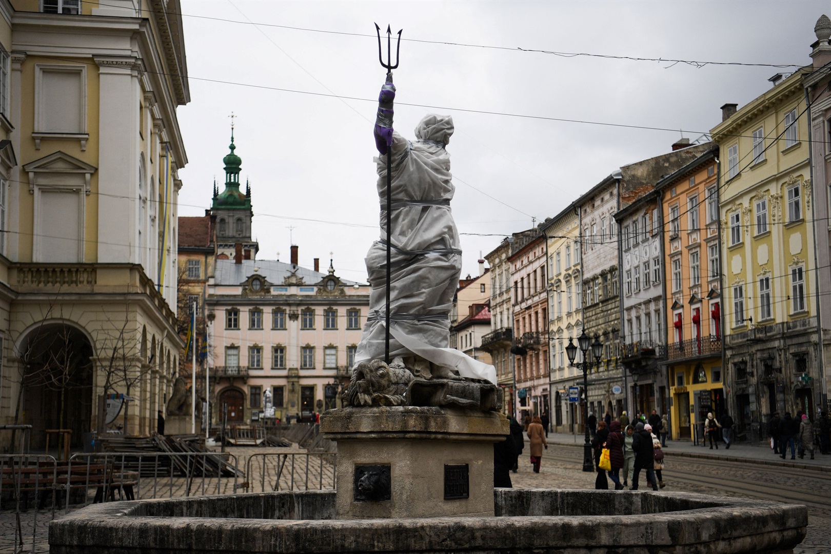 A statue outside the Latin Cathedral in Lviv, western Ukraine, is wrapped up to protect it from potential damage. DANIEL LEAL/AFP via Getty Images