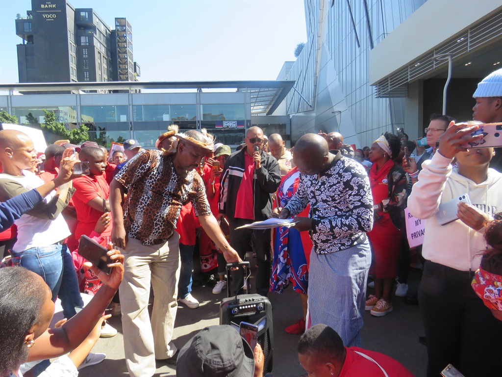 Leaders of izangoma handing over the memorandum to Moja Love's Archie Gwala (with a microphone). Photo by Ntebatse Masipa