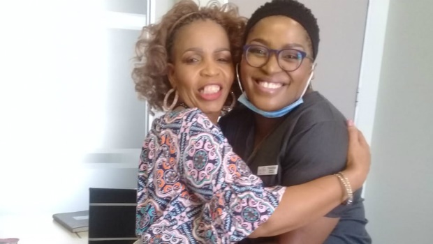 Moipone Thandeka Mokhali embraces her happy new client at her Fourways beauty clinic. Image supplied to W24