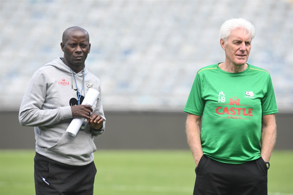 JOHANNESBURG, SOUTH AFRICA - MARCH 23: Helman Mkhelele (assistand coach) and Hugo Broos (coach) of Bafana Bafana during the South Africa mens national soccer team training session at Orlando Stadium on March 23, 2023 in Johannesburg, South Africa. (Photo by Sydney Seshibedi/Gallo Images)