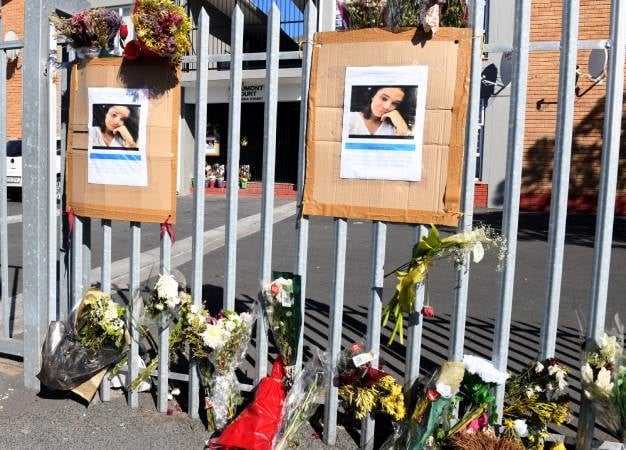 Flowers are placed outside Beaumont Court in Parow