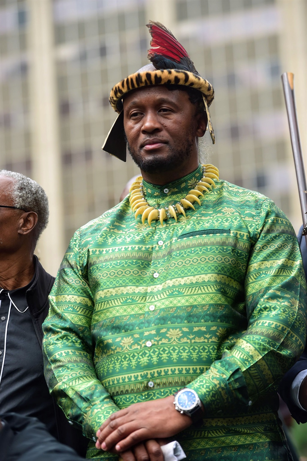 Prince Simphiwe Zulu with a green regalia outside 