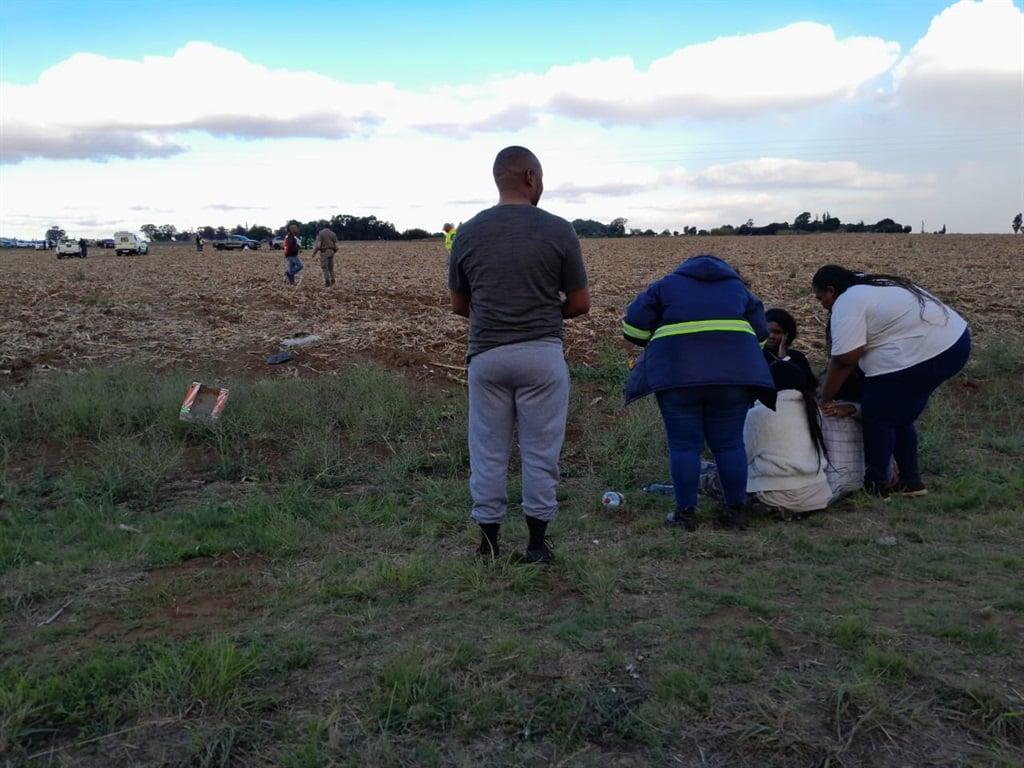 The deceased's family members crying uncontrollably near the field.  Photo by Ntebatse Masipa