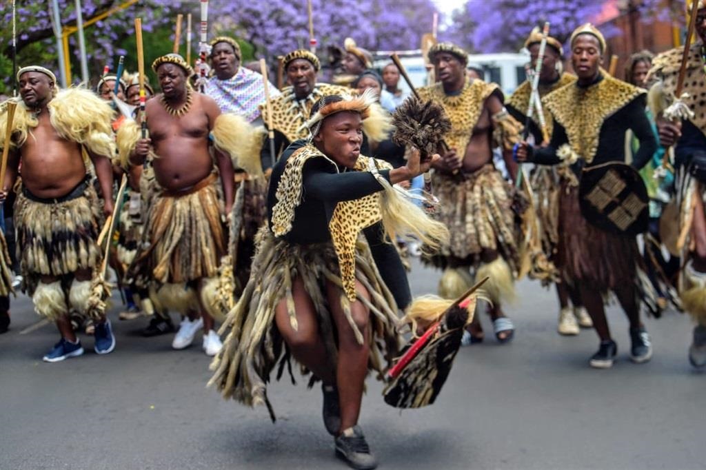 Amabutho occupied Madiba street outside the Pretoria Court with their traditional regalia, dancing and singing. Photo by Raymond Morare
