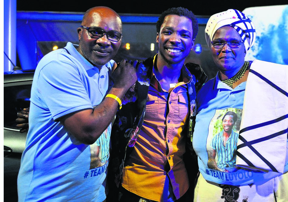 From left: Proud dad Dumisani Yiba with his son Luyolo and wife Nomboniso after Luyolo came out tops.   Photo by Morapedi Mashashe