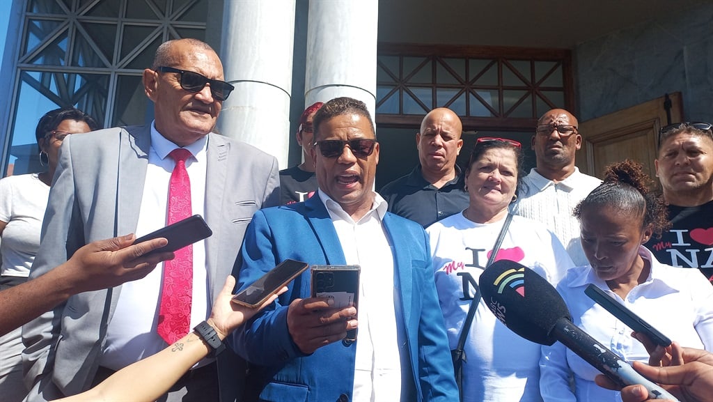 Nelson Mandela Bay Mayor Gary van Niekerk (middle) and fellow National Alliance councillor, John Mitchell (left) address the media outside the Eastern Cape High Court in Gqeberha.