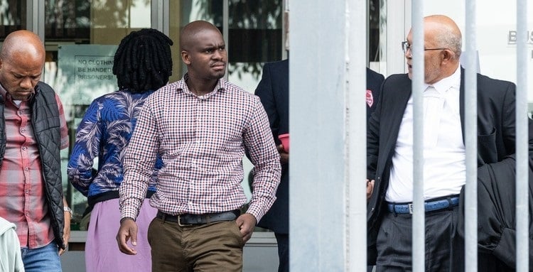 The Wynberg Magistrate’s Court has acquitted Cape Town law enforcement officer Luvolwethu Kati (centre) of the murder of Dumisani Joxo, a homeless man.