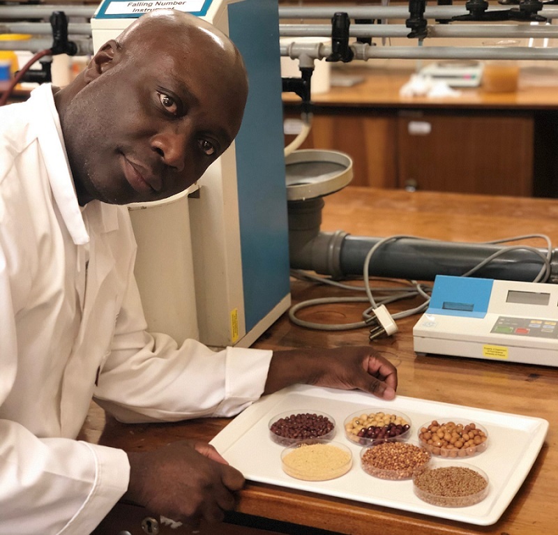 Professor Gyebi Duodu with African grainssuch as s